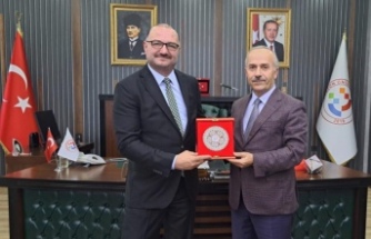 Rektör prof.Dr.Hacı Müftüoğlu Rektör prof.Dr. Kutlu‘yu ziyaret etti.